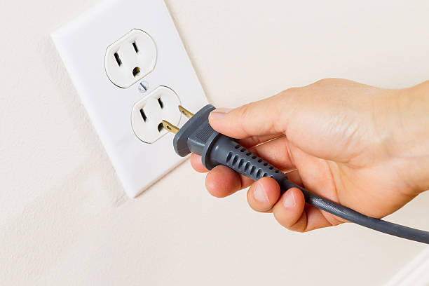 Unplug the cord from the wall outlet